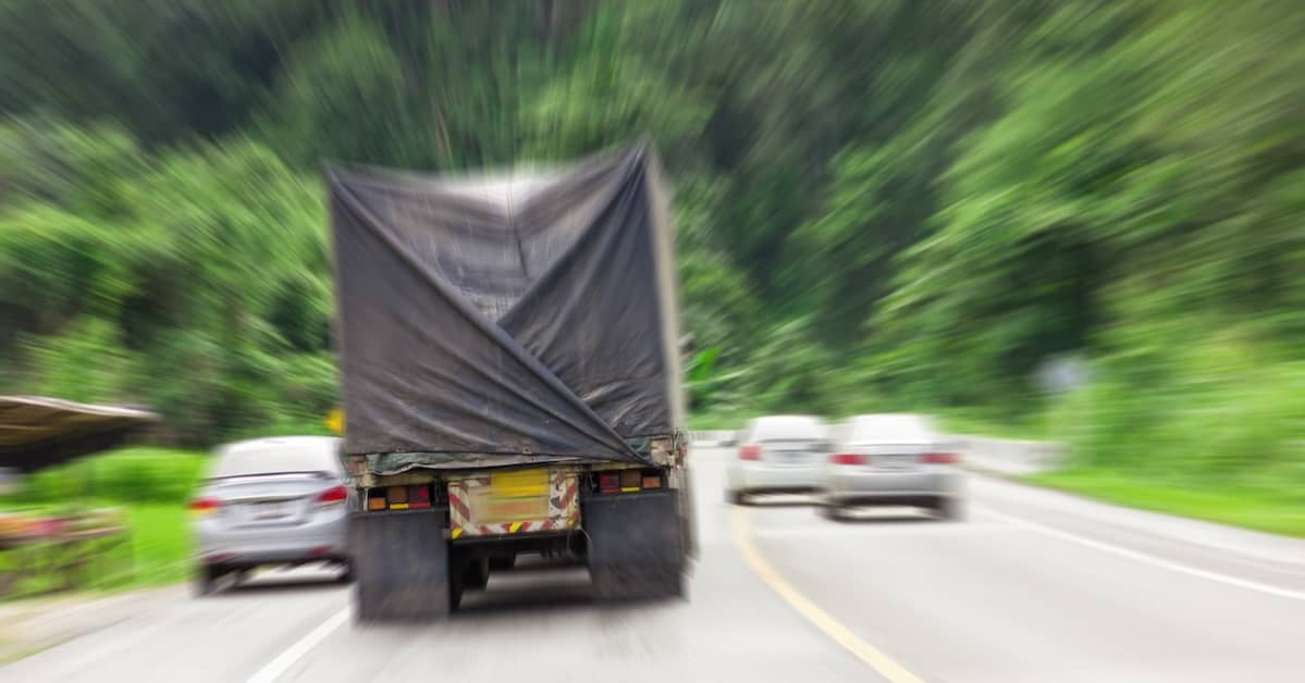 a truck drive down a mountain highway | Oliver Law Firm
